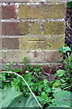 Benchmark on outbuilding at The Grange Farm