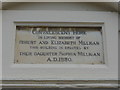 Plaque above a doorway in West Street