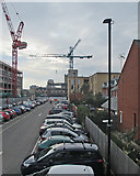 TL4657 : Cranes and Cambridge Station car park by John Sutton