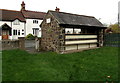 Bench on the back of a Main Street bus shelter, Caersws