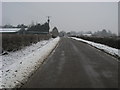 TL0179 : Road passing Newbrook Farm by Shaun Ferguson