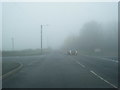 NZ3342 : B1283/Crime Rigg Bank junction in fog by Colin Pyle
