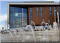 Dancing water with the new 6th form college under construction in the background