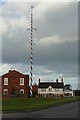 SK6666 : Two maypoles at Wellow by Graham Hogg