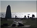 SY6768 : Bill of Portland: people and obelisk in near silhouette by Chris Downer