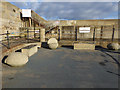 Concrete forms and benches at the base of the Heugh Breakwater