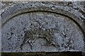 SW9642 : Caerhays, St. Michael's Church: Weathered "Agnus Dei" above the Norman north doorway by Michael Garlick