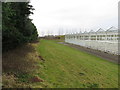 Nursery greenhouses viewed from Keyingham Triangulation Pillar