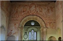 TQ2913 : Clayton; The Church of St. John the Baptist: Wall paintings above the plain Norman chancel arch by Michael Garlick