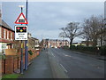 Approaching the level crossing on Muston Road (A1039), Filey