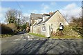 Buildings on road junction near Huckworthy Bridge