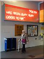 SD8010 : A neon poem and a walking woman in Bury by Neil Theasby