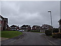 Approaching the junction of Tarbery Crescent and Bridget Close