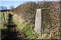 North Leigh trig point beside muddy footpath