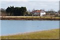 Russell Green House from across the flooded gravel pit