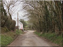W5265 : Farm house on a junction on a country road by Hywel Williams