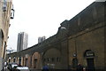 TQ3480 : View of old railway arches on Pinchin Street by Robert Lamb