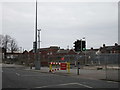 Road barrier and demolition site