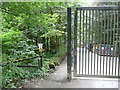 Footpath passing gate on driveway to the recycling centre, Sowerby