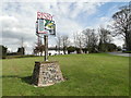 Risby village sign and War Memorial in the background