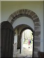 SS8403 : Norman arch and porch of St Mary's church, Upton Hellions by David Smith