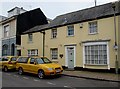 Yellow cars outside the yellow Old Bank, Shaldon