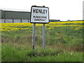 Henley Village Name sign on Main Road