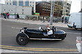 View of a Morgan three wheeler leaving the Classic Car Boot Sale on Goods Way