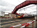 Virgin West Coast train at Logans Road level crossing