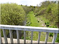 Looking from road bridge west along River Mole and path