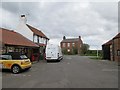 Red  Lion  Inn  exiting  car  park  onto  Hodgson  Lane