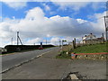 Road (B2011) at the entrance to the Royal Oak PH car park