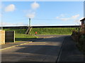 The junction of Marine Avenue with Hythe Road (A259) with Dymchurch Wall beyond