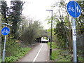 Path heads towards way under rail bridge