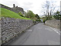 Castle Lane and a bench mark