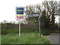 TM1349 : Roadsign & Estate Agent Sale Board on The Slade by Geographer