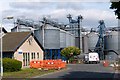 NU1233 : Grain silos, Belford by Robin Drayton