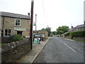 Bus stop and the Old Village Shop, Edmundbyers