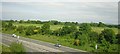 SJ8479 : A34 Wilmslow by-pass from the railway by Christopher Hilton