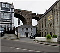 Two-storey house dwarfed by three structures, Redruth