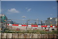 View of buildings in Stratford from the River Lea towpath