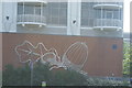 TQ3880 : View of an acorn mural on the wall of Switch House by Robert Lamb