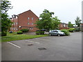 Looking across parking area at east end of Bolton Road