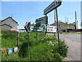 Defaced road direction signs at Whitecross Crossroads