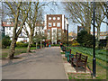 TQ2480 : Path and benches, Avondale Park by Robin Webster