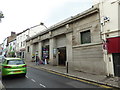 SX0667 : Bodmin Town Centre - building with stone cattle heads by Chris Allen