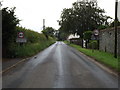 TL9685 : Entering Bridgham on The Street by Geographer