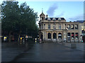 TL1998 : HSBC Bank, Cathedral Square, Peterborough, at dusk after rain by Robin Stott