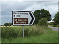 TL9984 : Roadsign on West Harling Road by Geographer