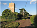 SK4943 : Swingate: Babbington Lane and Swingate Water Tower by John Sutton